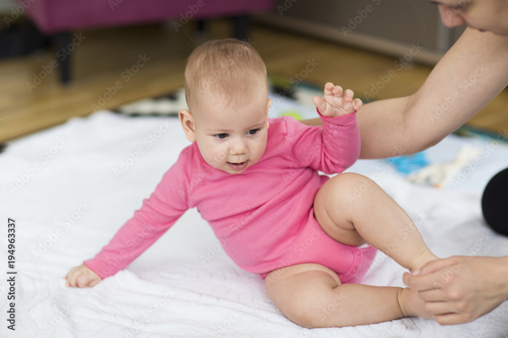 baby sitting up exercise. selective focus