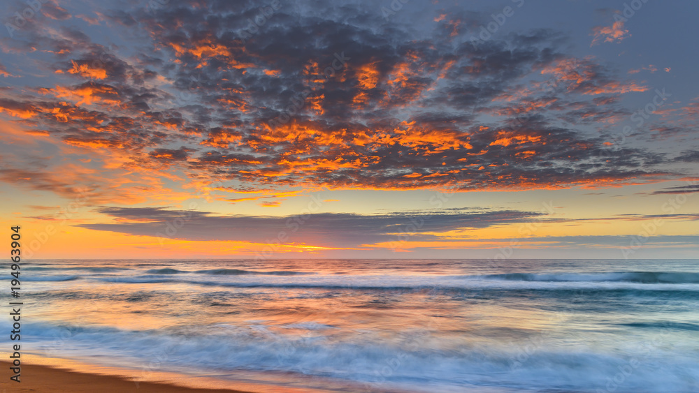 Vibrant Sunrise Seascape with Clouds