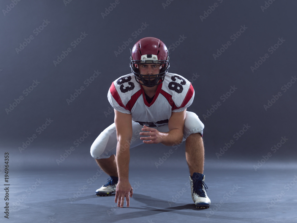 American football player getting ready before starting