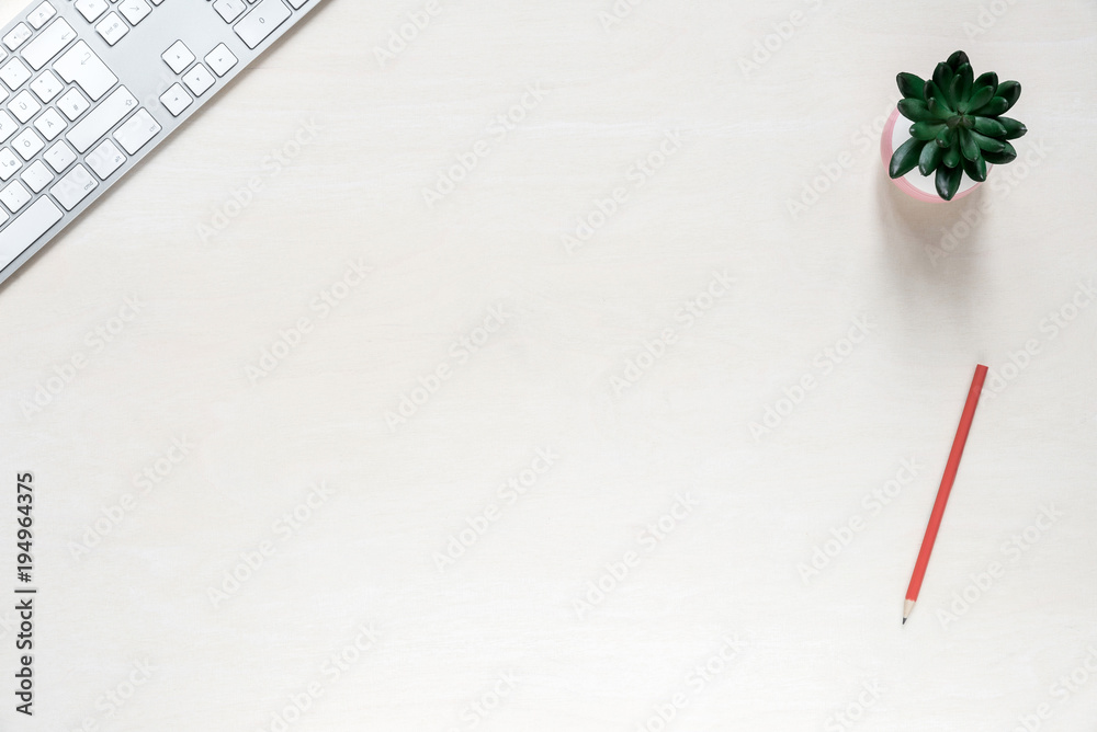 Copy space on white desk background with keyboard and plant Copy space on white desk background with keyboard and plant