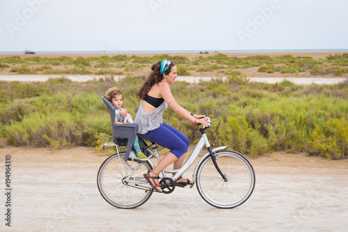 Woman riding with a toddler