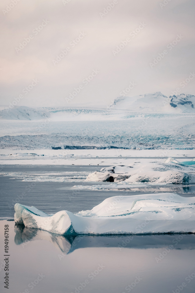 Fototapeta premium Winter landscape view of popular Glacier Lagoon with many small icebergs - Jokulsarlon, east Iceland.