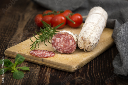  Dried salami with rosemary, basil and tomatoes.