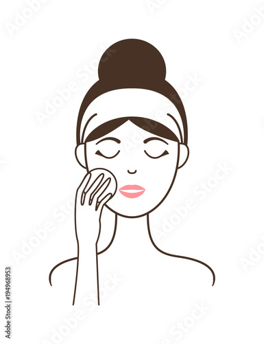 Young Girl Cleans Her Face with Round Cotton Pad