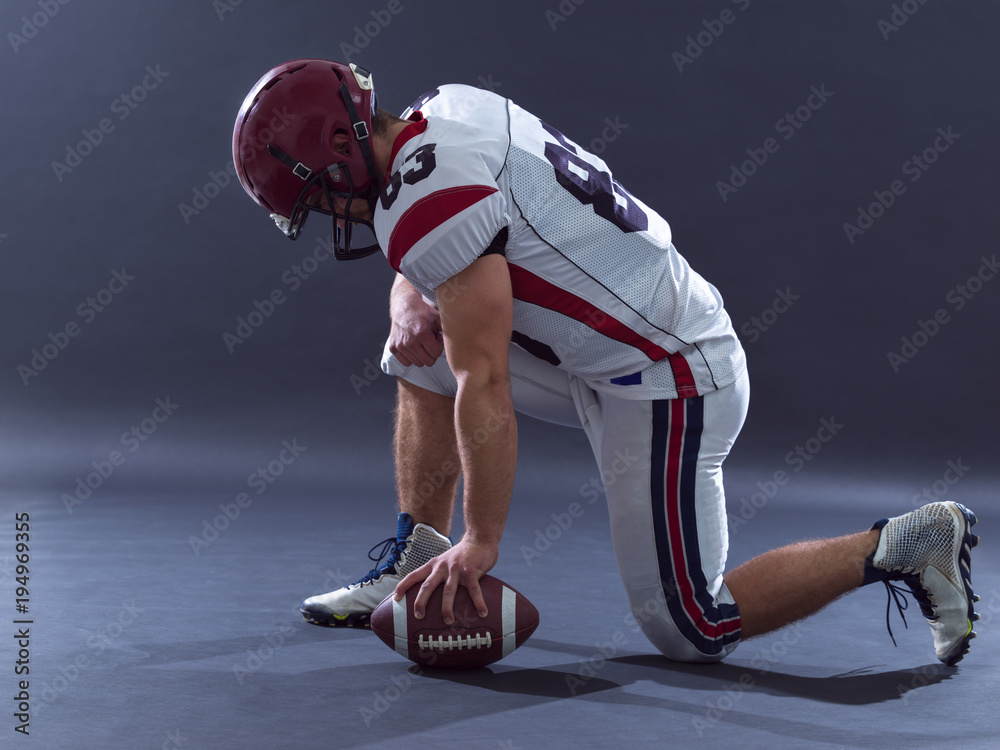 American football player getting ready before starting