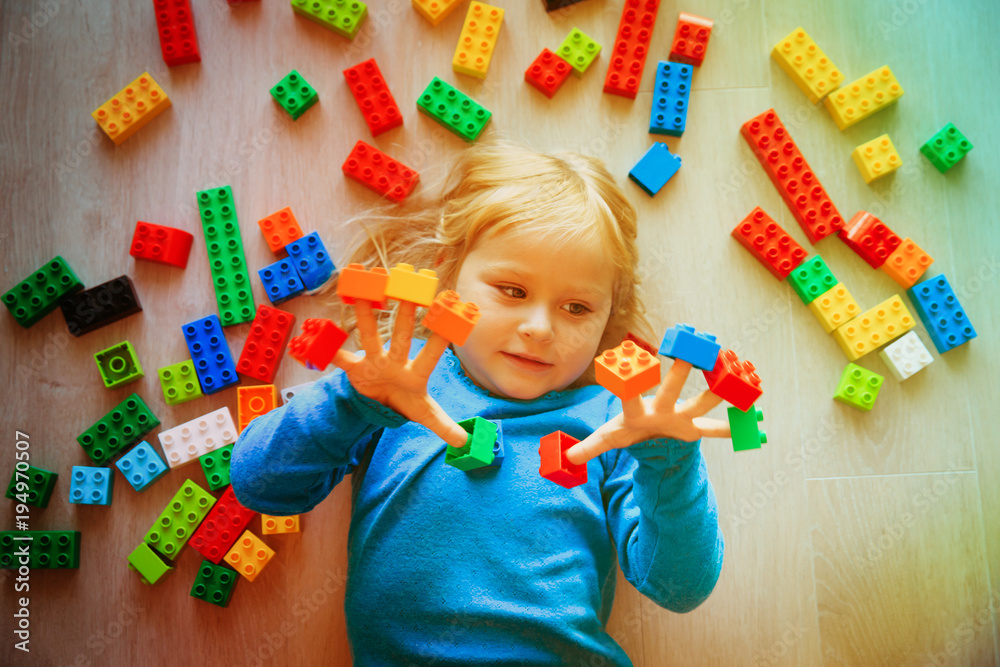 cute little girl play with plastic blocks cute little girl play with plastic blocks
