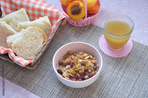 Healthy Breakfast: oatmeal, muesli, dried fruit, fruit juice, crispy bread top view