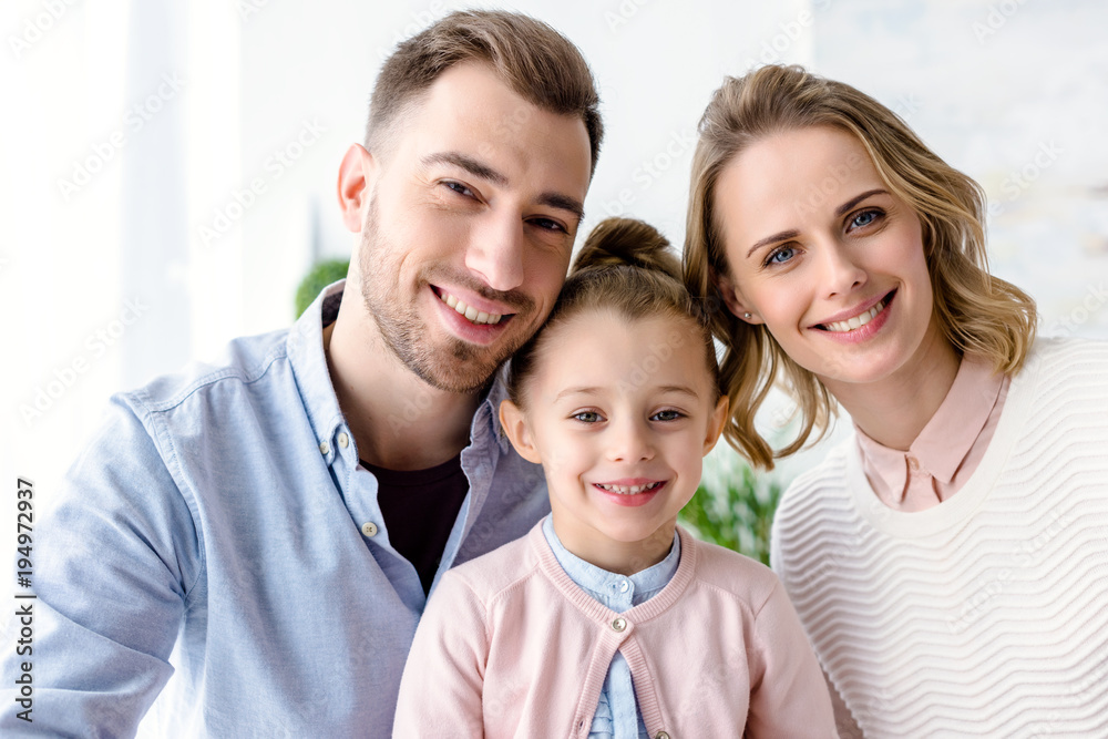 Adorable family with daughter in casual clothes Adorable family with daughter in casual clothes