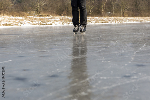 Ice skating on natural ice ring in the Netherlands