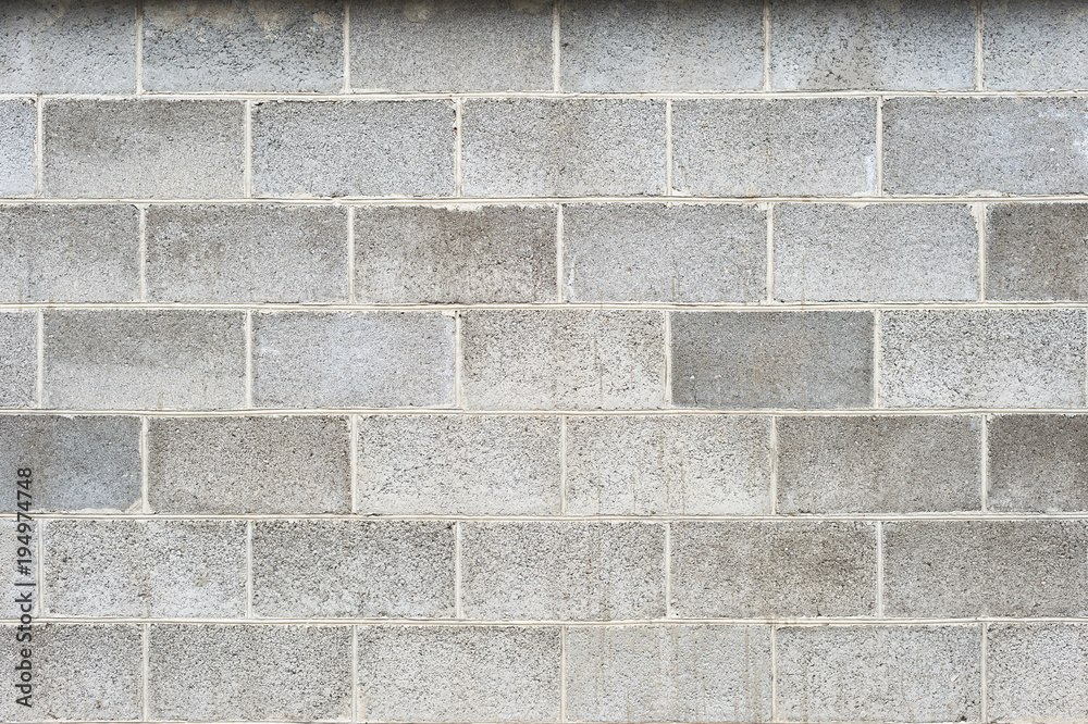 Fototapeta premium The texture of the wall is the laying of expanded clay blocks. Background for the advertisement of building materials. Gray concrete foam block