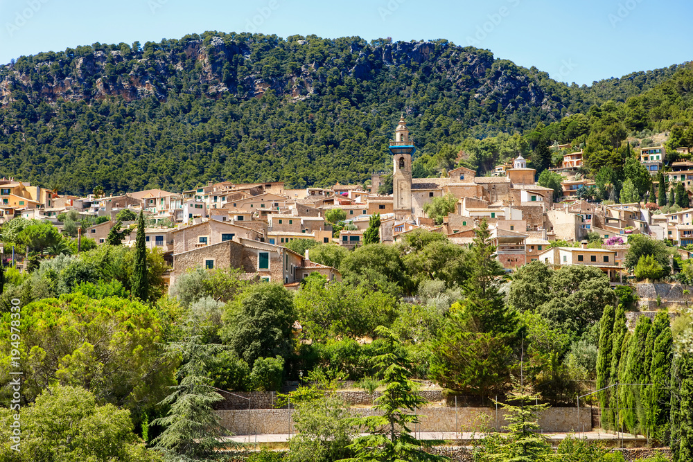 View on city Valldemossa with traditional flower decoration, famous old mediterranean village of Majorca. Balearic island Mallorca, Spain