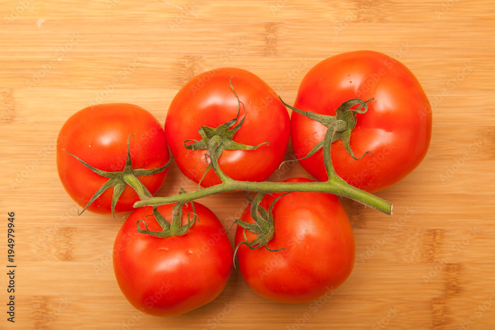 Tomatoes on wooden background Tomatoes on wooden background