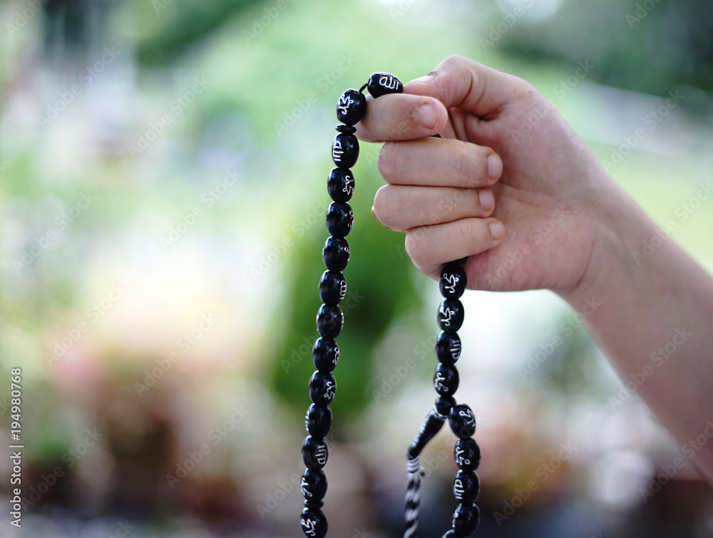 Muslim Woman hand with rosary Muslim Woman hand with rosary