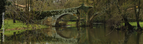 Roman bridge reflected in the river