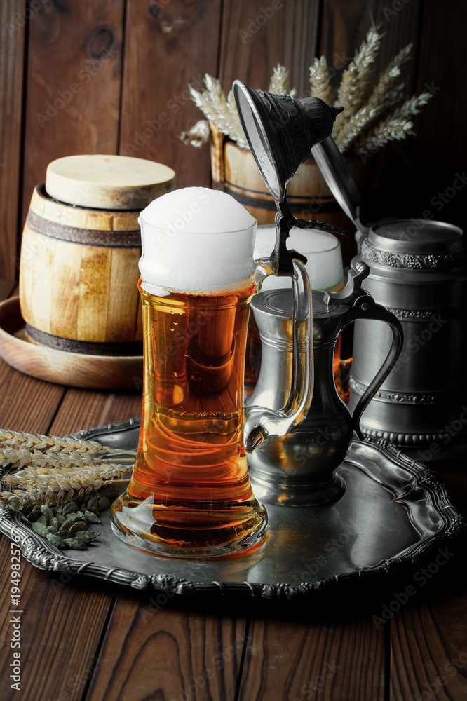 Light foam beer in a glass on an old background Light foam beer in a glass on an old background