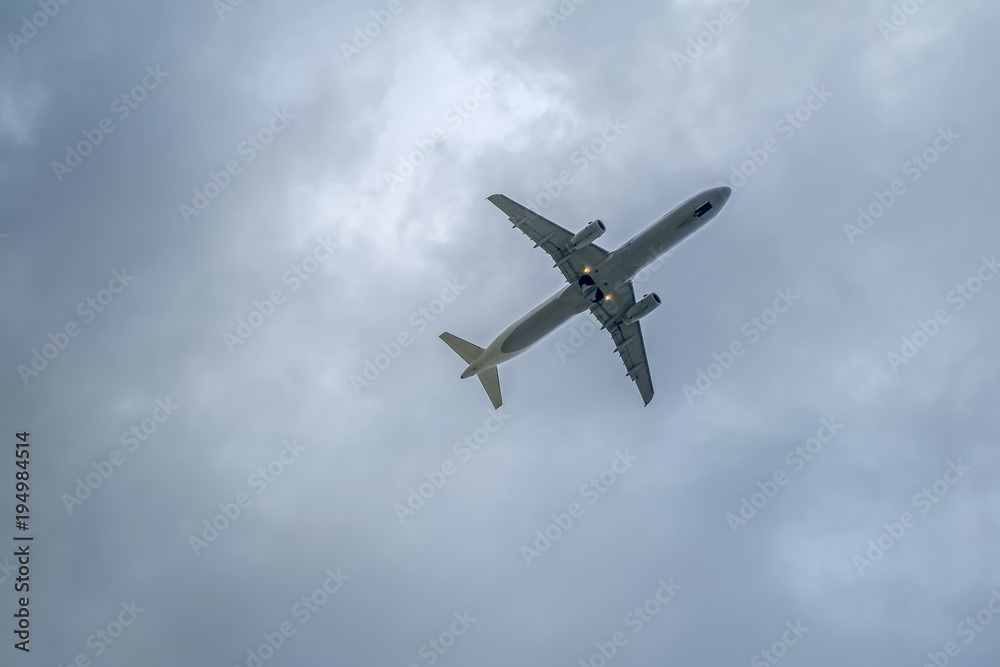 airplane in the sky, bottom view