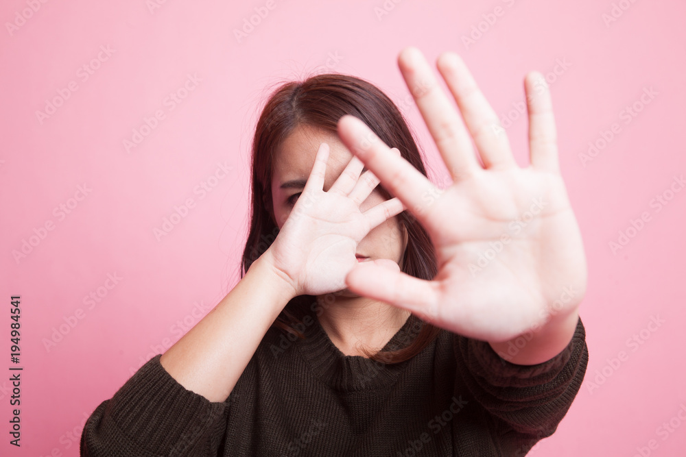 Young Asian woman hide her face. Young Asian woman hide her face.