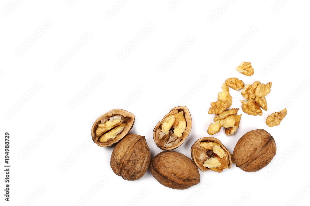 Cracked walnuts isolated on white background, top view Cracked walnuts isolated on white background, top view