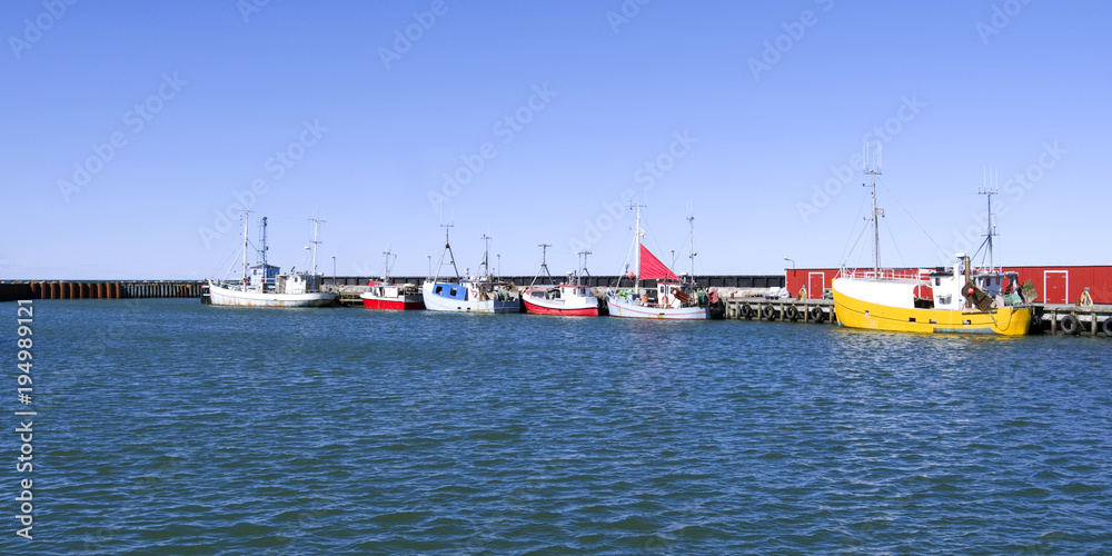 Laesoe / Denmark: Fishing cutters moored at the pier in the fishing port of Oesterby Havn