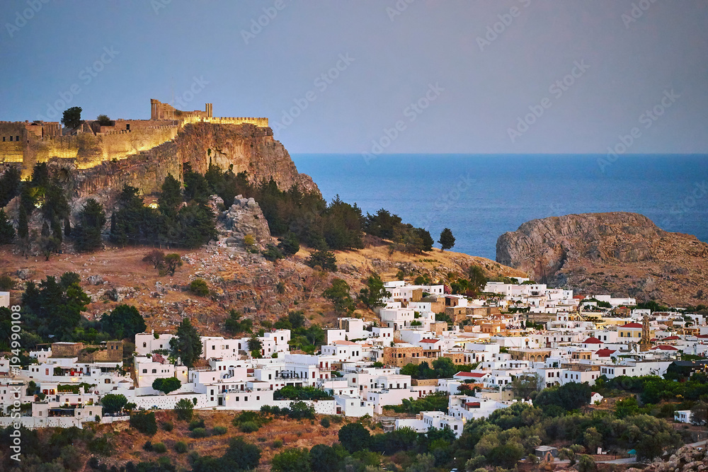 Lindos town and Acropolis on Rhodes island after sunset