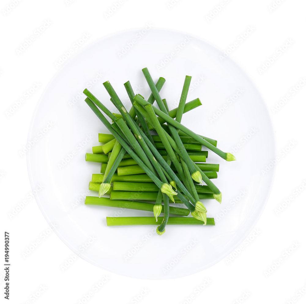 fresh Allium tuberosum in white plate isolated on white background fresh Allium tuberosum in white plate isolated on white background