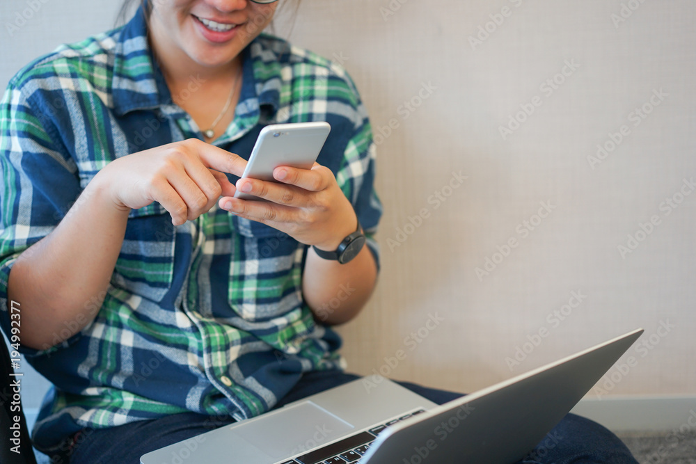 close up teenager woman playing smartphone in freetime with laptop, technology concept close up teenager woman playing smartphone in freetime with laptop, technology concept