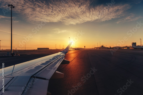 View of the airport and airplane wing from the Inside