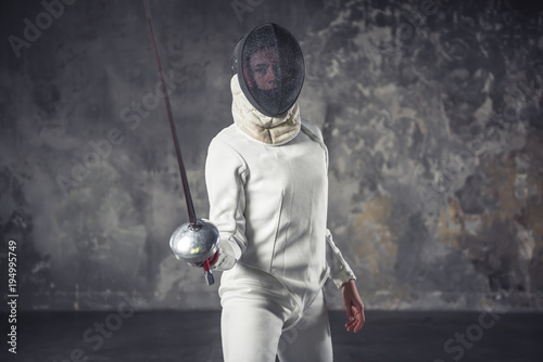 Fototapeta Naklejka Na Ścianę i Meble -  Woman is fencing