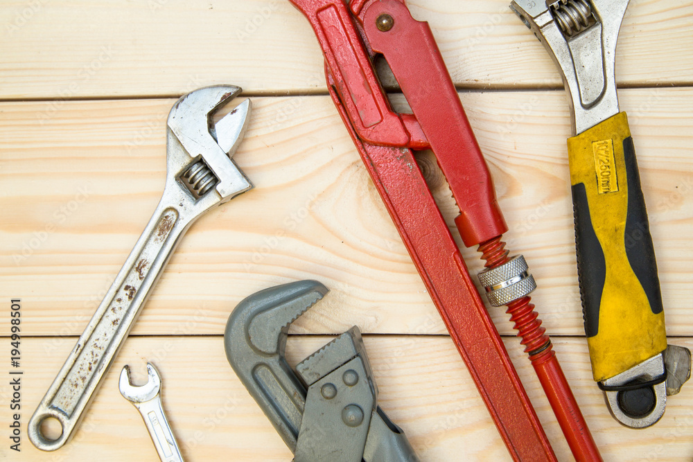 Tools for repair on light wooden background Tools for repair on light wooden background