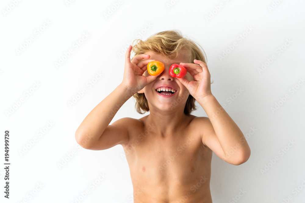 Boy having fun with fruits and vegetables Boy having fun with fruits and vegetables