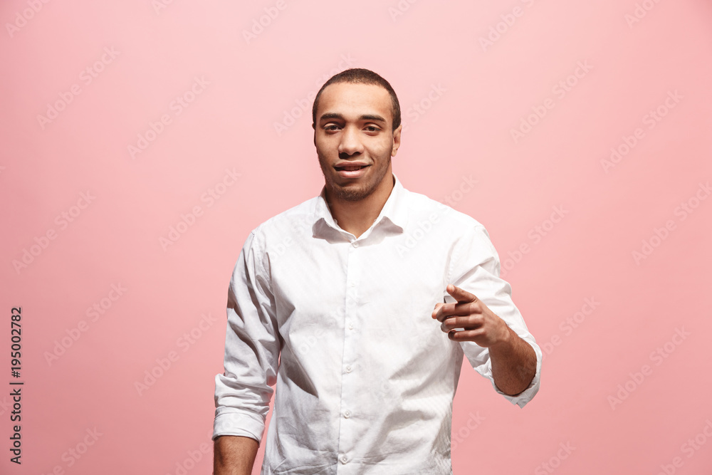 The happy business man point you and want you, half length closeup portrait on pink background. The happy business man point you and want you, half length closeup portrait on pink background.