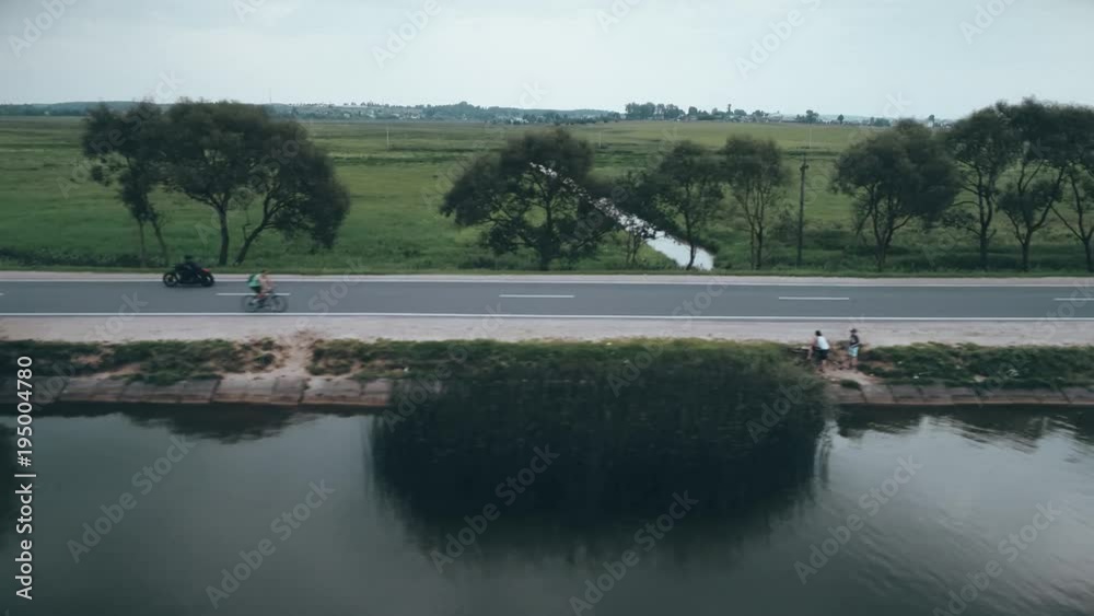 4K aerial drone of biker rides a motorcycle on the old road 4K aerial drone of biker rides a motorcycle on the old road