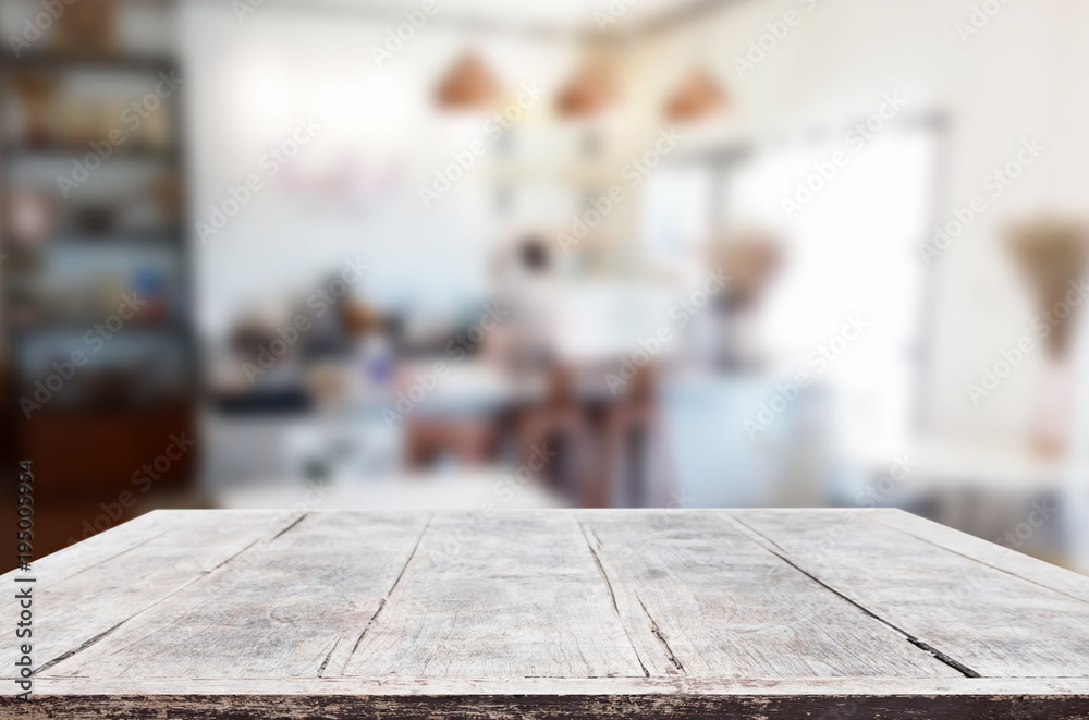Selected focus empty brown wooden table and Coffee shop or restaurant blur background with bokeh image. for your photomontage or product display. Selected focus empty brown wooden table and Coffee shop or restaurant blur background with bokeh image. for your photomontage or product display.