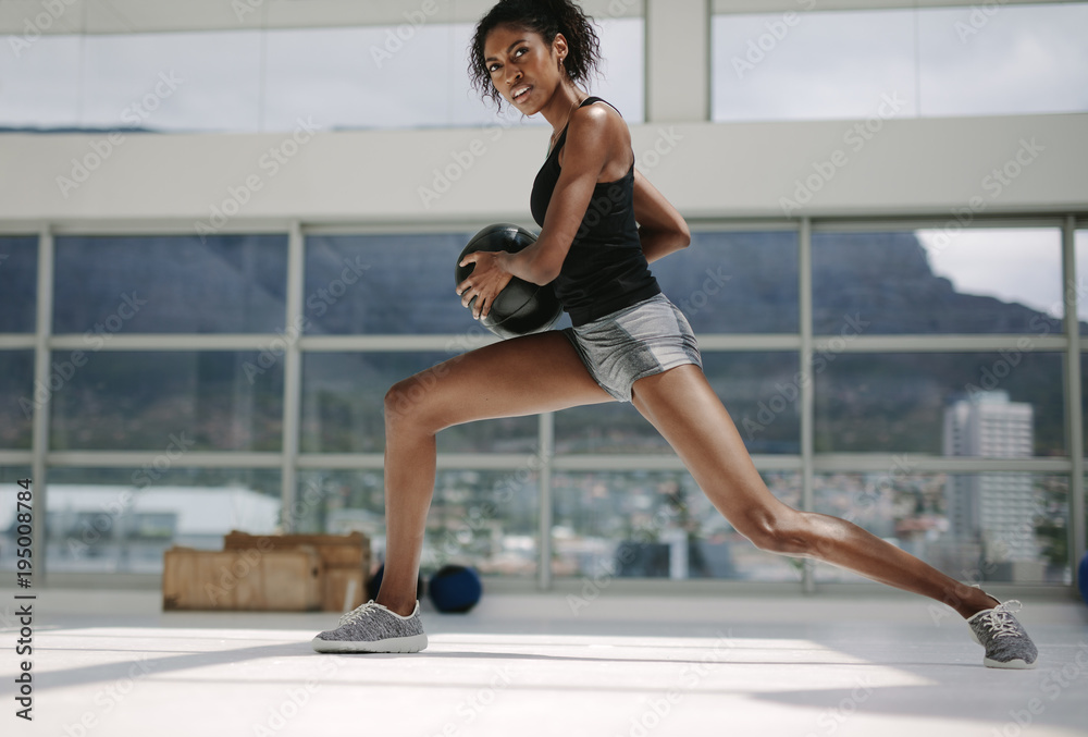 Fitness woman working out with medicine ball Fitness woman working out with medicine ball