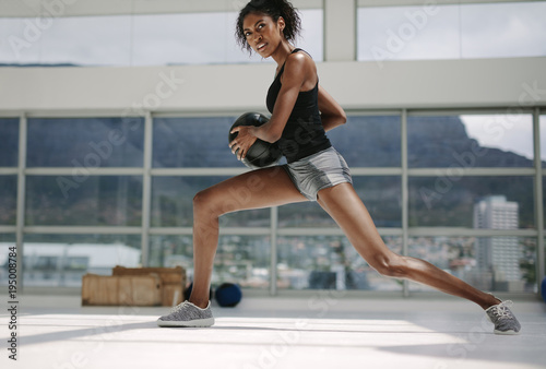 Fitness woman working out with medicine ball