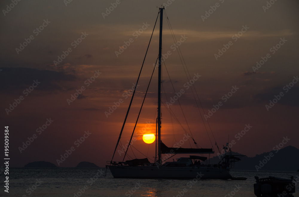 Boat on the sea at sunset in Adang-Ravi Islandsin,Tarutao National Park, Satun Thailand.