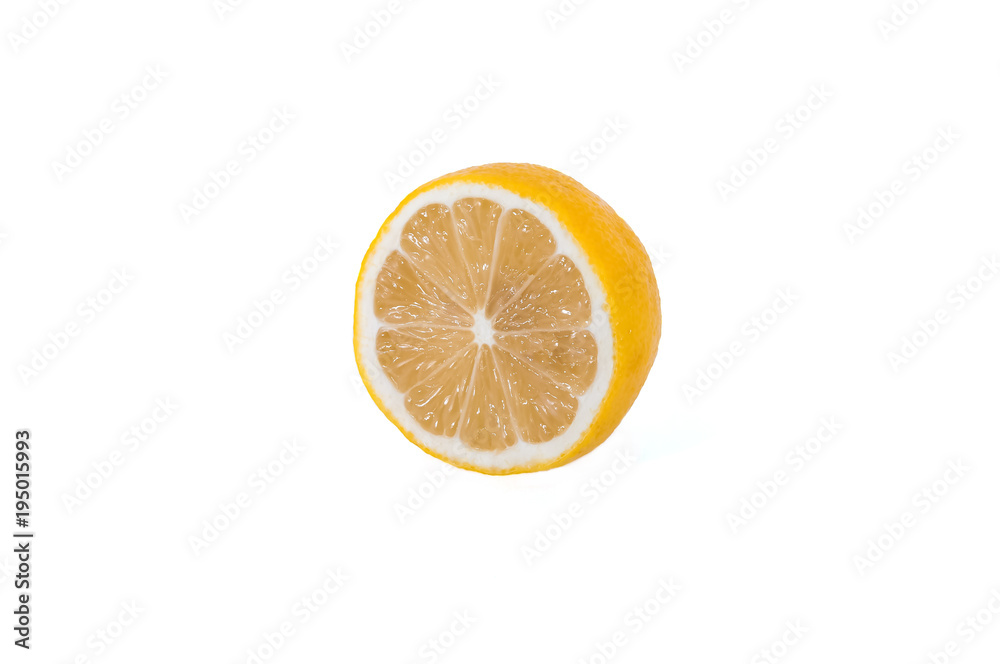 A half ripe lemon is isolated on a white background. A half ripe lemon is isolated on a white background.
