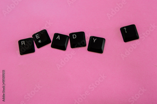 Black keys of a computer keyboard forming the phrase 