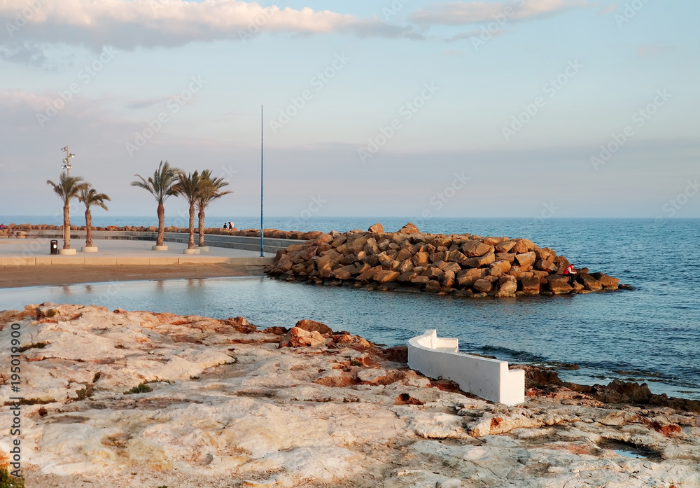Αυτοκόλλητο Sunset on the rocky beach of Torrevieja. Spain