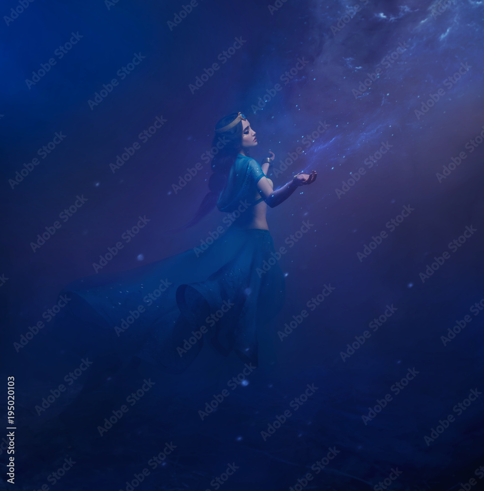 A girl in oriental attire, Queen of the storm. Princess Jasmine. The background is a twist and a strong wind. Studio shooting with mixed light. Artistic Photography A girl in oriental attire, Queen of the storm. Princess Jasmine. The background is a twist and a strong wind. Studio shooting with mixed light. Artistic Photography