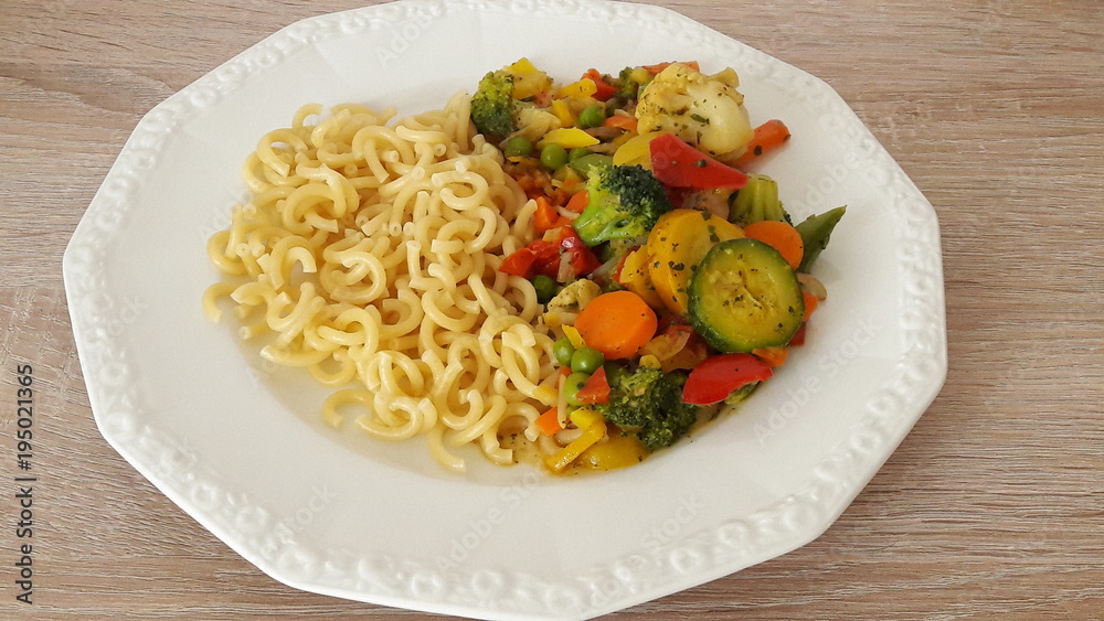 pasta cooked with vegetables in a white plate pasta cooked with vegetables in a white plate