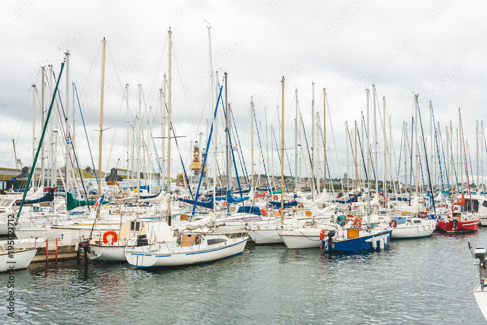 Variety of yachts and boats moored in harbour of port city of Saint-Malo, Brittany, France