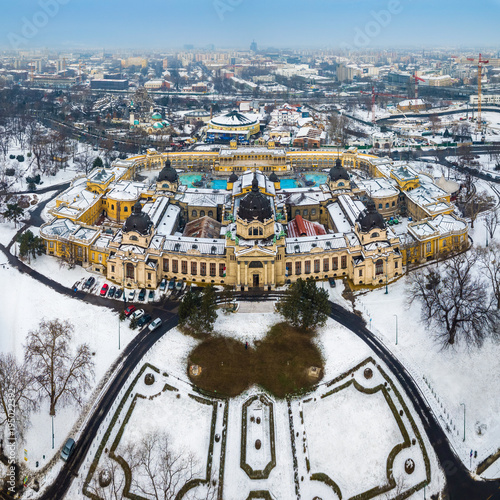 Budapest, Hungary - Aerial skyline view of the famous Szechenyi Thermal Bath in City Park (Varosliget) on a snowy winter morning photo