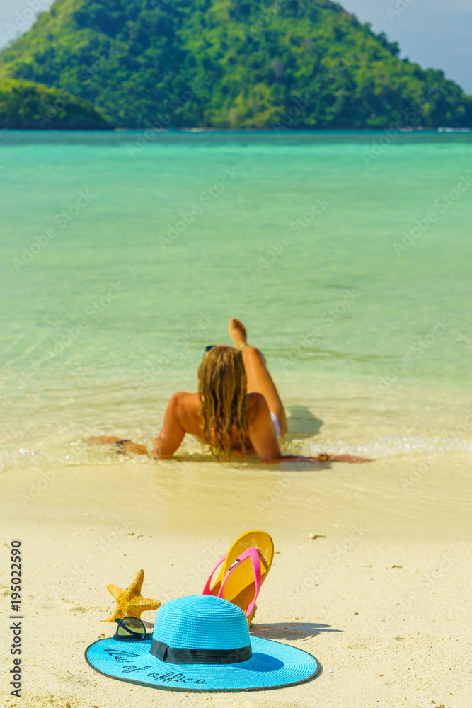 Woman at the beach in Koh Poda island Thailand with out of office straw hat Woman at the beach in Koh Poda island Thailand with out of office straw hat