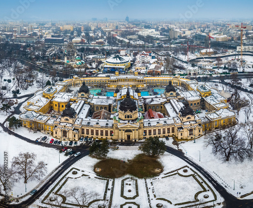 Budapest, Hungary - Aerial skyline view of the famous Szechenyi Thermal Bath in City Park (Varosliget) on a snowy winter morning photo