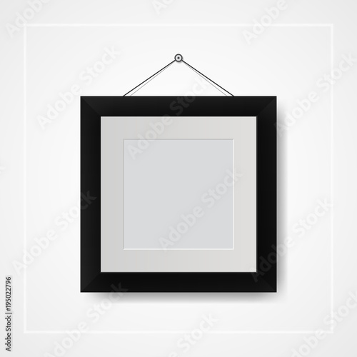 Multiple many small picture and photo frames on white wall