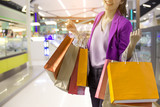 woman holding shopping bag in mall