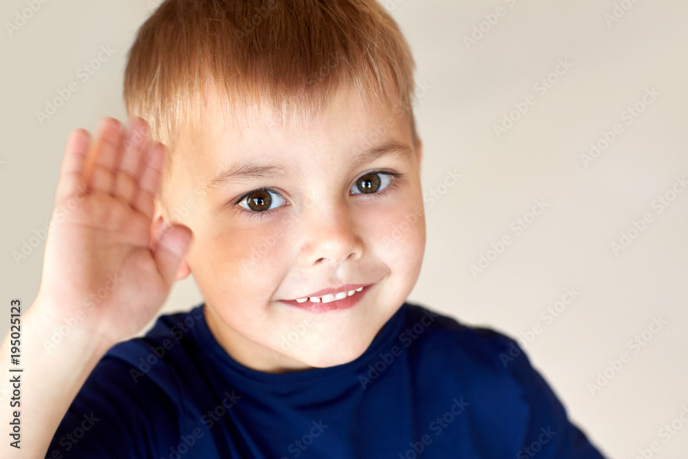 portrait of happy smiling little boy waving hand portrait of happy smiling little boy waving hand