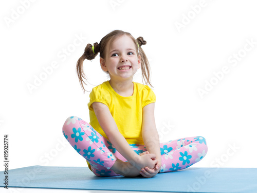 Child girl practicing yoga,...