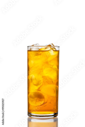 orange drink in a glass on a white background